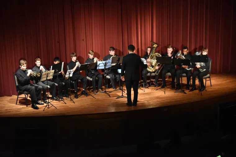 NCYO brass ensemble performing with their conductor