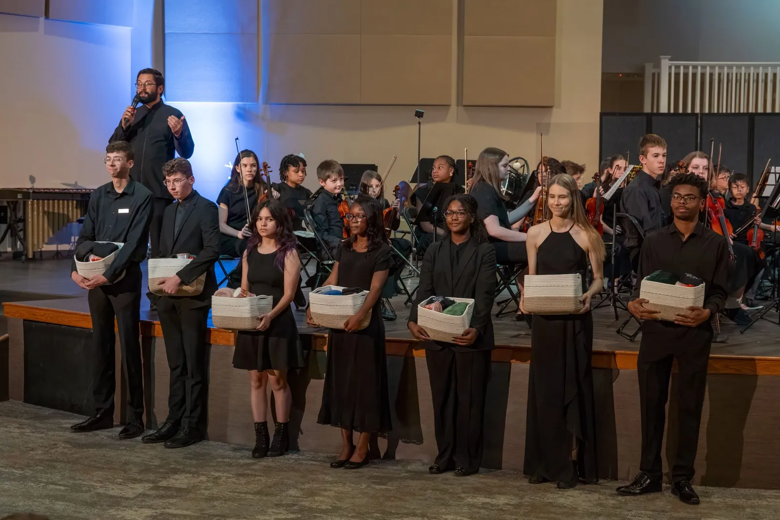 The full North Carolina Youth Orchestra on stage with its student leaders