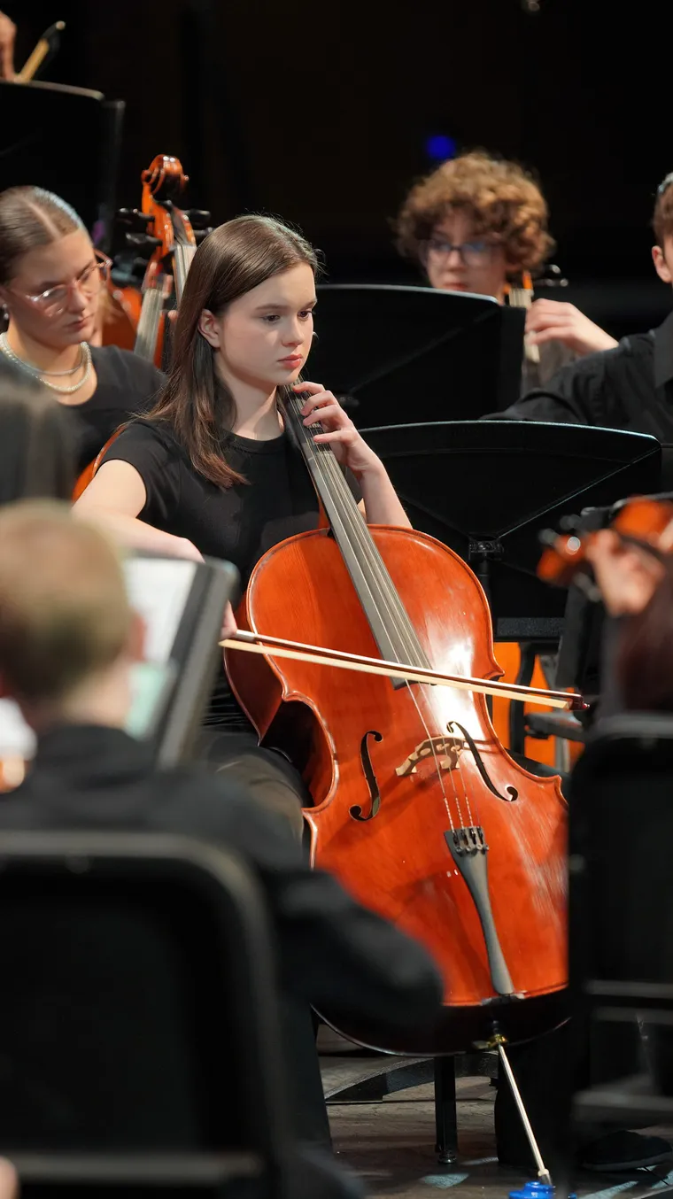An NCYO conductor leading the ensemble