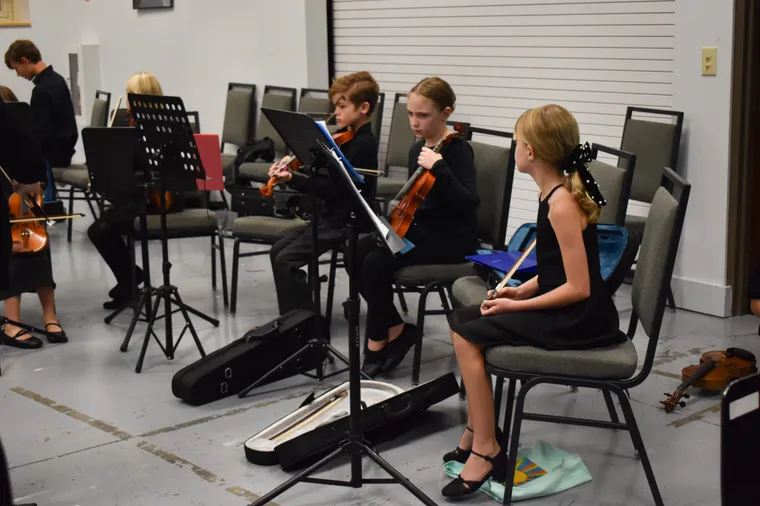 NCYO students gathered backstage before a concert